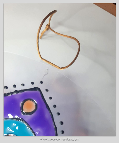 Taped string to suncatcher to hang it.
