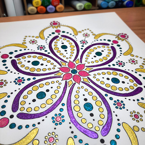 Coloring page colored with glitter markers.